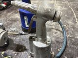 an image of a drill on a table in a workshop