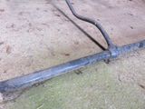 a pipe that is laying on the ground next to the ground