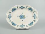 a close up of a plate with blue flowers on it