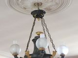a chandelier hanging from the ceiling in a room