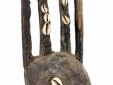 an image of a close up of a wooden object with shells on it