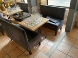 a table with glasses on it in a restaurant