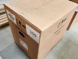 a box that is sitting on the floor in a room