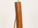 a wooden vase with a wooden handle on a white background