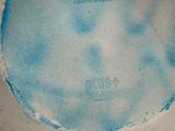 a cake with blue frosting on it on a white plate