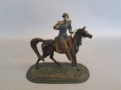 figurine of a man on a horse on a white background