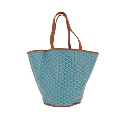 un sac fourre-tout bleu avec une poignée marron