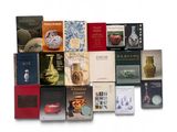 a lot of books that are sitting on a table