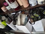 a cluttered desk with a lot of items on it