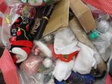 a pile of christmas items in a bag on the floor