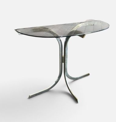 an image of a glass table with a metal base and a glass top
