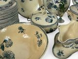 a lot of plates and bowls that are sitting on a table