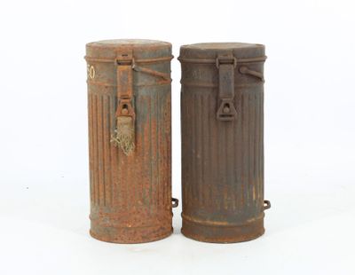 two trash cans sitting next to each other on a white surface