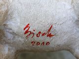 a white horse with red writing on the side of it
