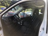 the interior of a car with the door open and the driver ' s seat down