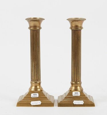 pair of antique brass candlesticks on marble bases