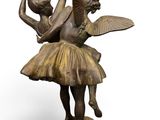 bronze statue of a ballerina and a dancer on a pedestal