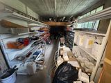 a room filled with lots of shelves and bins