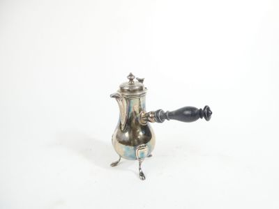 a silver coffee pot with a black handle on a white background
