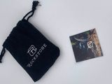 a small black bag with a picture of a giraffe on it