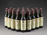 six bottles of wine are lined up in a row