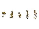 four pairs of gold earrings on a white background
