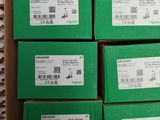 several boxes of green boxes are stacked on top of each other