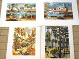 four prints of paintings of trees and a lake on a tile floor