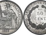 a close up of a coin with a statue on it