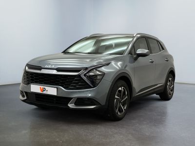 a grey suv parked in a room with a white wall