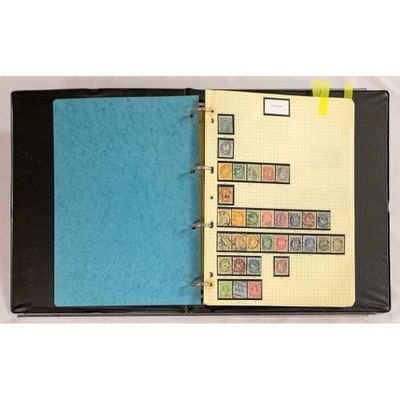 a black binder with a blue cover and stamps on it