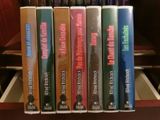 a lot of books that are sitting on a shelf