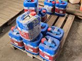 a pallet with several blue and red jerrys on it