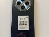 the back of a black cell phone with a sticker on the back of it