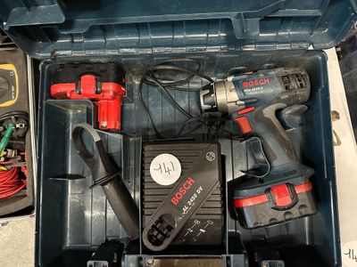 a tool box with tools in it on a table