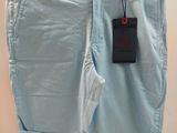 the shorts are light blue and have a small tag on them