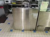 a stainless steel dishwasher sitting in the middle of a kitchen