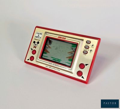 a small red and white electronic device on a white surface