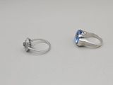 a couple of rings sitting on top of a table next to each other