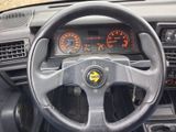 dashboard of a car with a steering wheel and gauges on it
