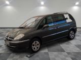 a picture of a black minivan parked in a garage