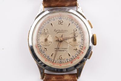 an image of a watch with a brown leather strap on a white surface