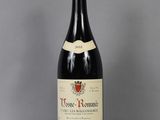 a bottle of wine that is sitting on a table