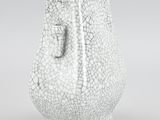 a close up of a white vase with a cracky surface