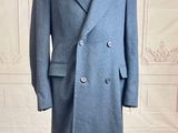 an image of a coat on a mannequin stand