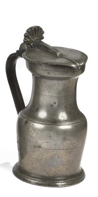a silver pitcher with a handle on a white background