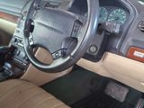 a car dashboard with a steering wheel and a dash board