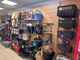 many bags hanging on the wall in the store