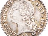 une pièce d'argent portant une tête de femme