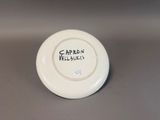a white plate with a black writing on it